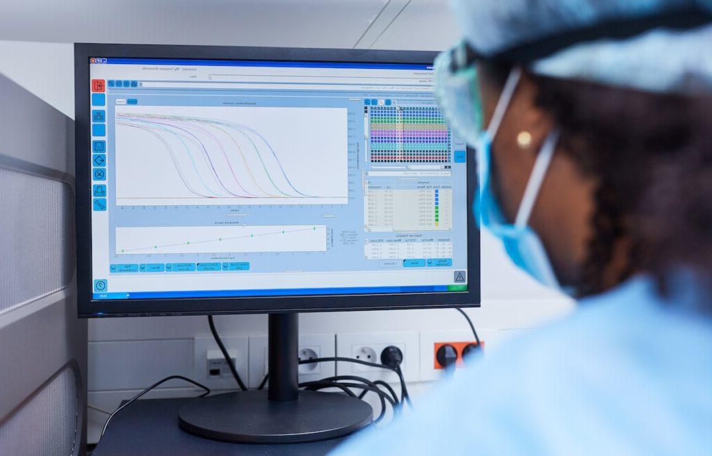 Researcher analyzing data on the computer in the laboratory at Covid-19 vaccine 研究, biological and physical, bachelor of science biology, biology degree sciences